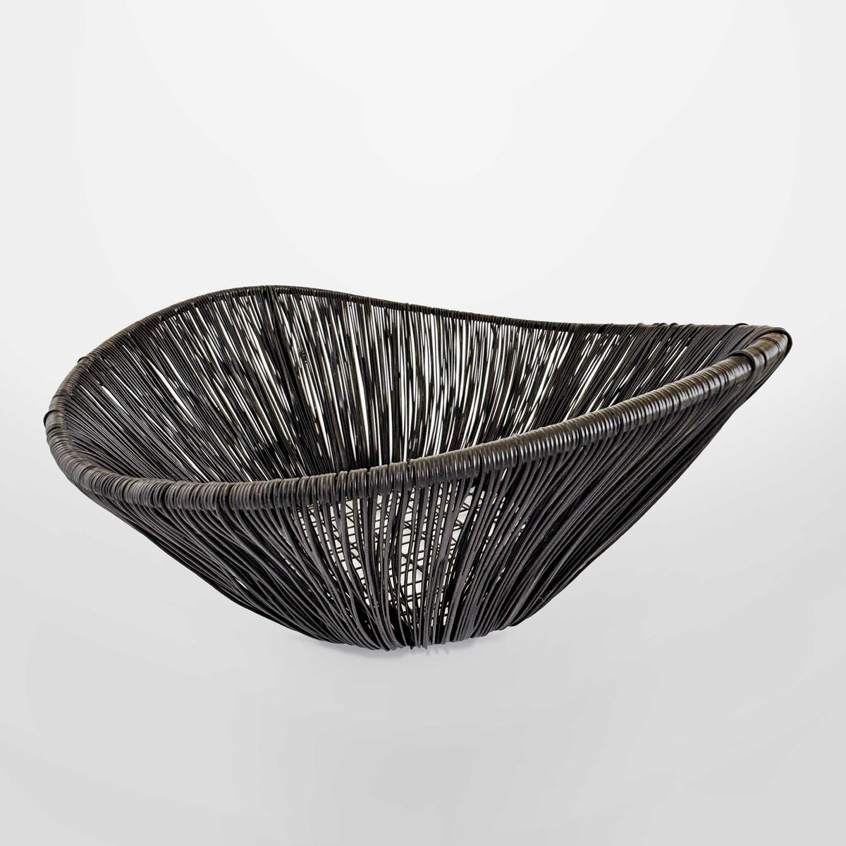 M. By Design - Curated tabletop essentials. Black woven bowl on a light gray background
