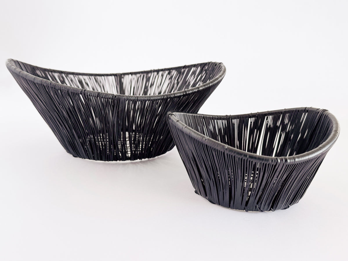 M. By Design - Curated tabletop essentials. Two black ceramic bowls with textured surface on a white background